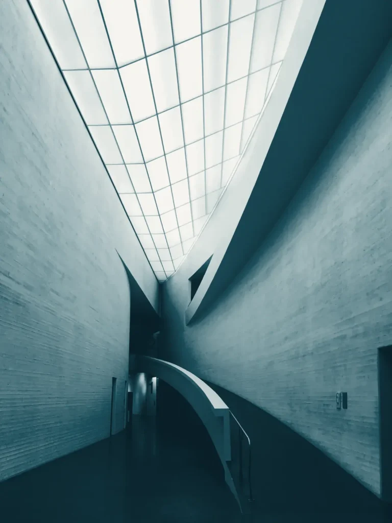 Daylight falling through a skylight into a long gallery corridor